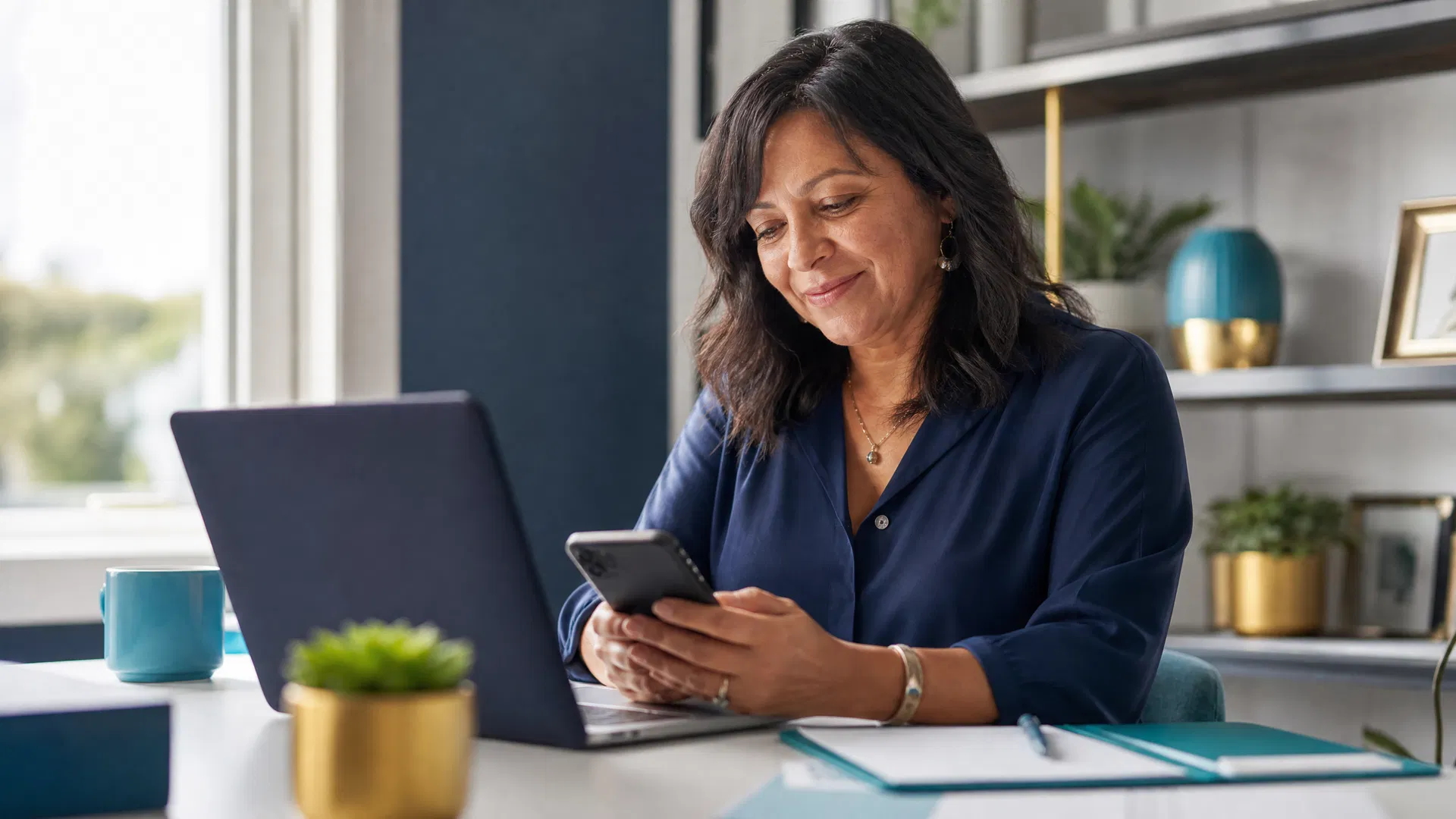 Sarasota business owner reviewing customer feedback across multiple platforms on phone and laptop