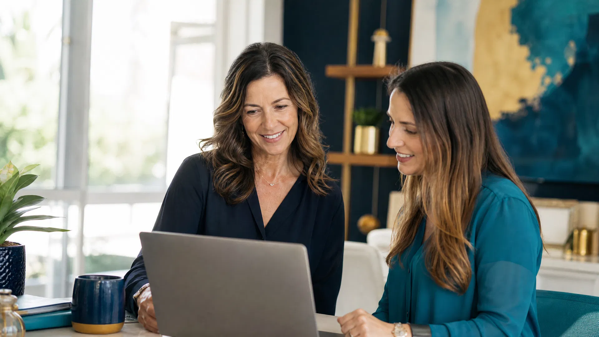 Sarasota business owner reviewing digital visibility strategy on a laptop in a bright modern office with warm natural light