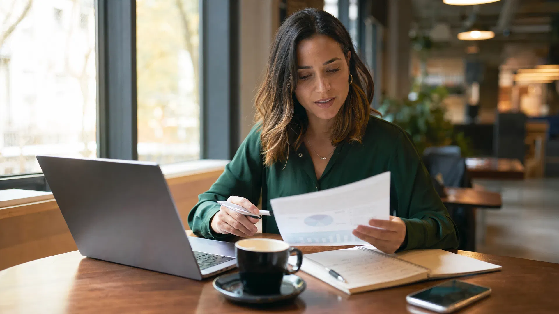 Sarasota business owner reviewing marketing performance on a laptop in a modern office